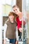 Cheerful woman with her daughter looking at a shower cabin
