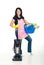 Cheerful woman holding cleaning products