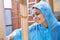 cheerful woman house painter repairing wooden structure