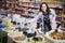 Cheerful woman purchasing lentil in shop