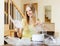 Cheerful woman reading user manual for steamer