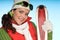 Cheerful woman in red and green winter outfit