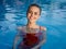 cheerful woman in red swimsuit swimming pool smile luxury nature