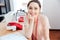 Cheerful woman seamstress sitting and smiling at work