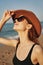 cheerful woman in sunglasses Sandy coast landscape sun