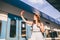 Cheerful woman traveler with backpack taking photo. selfie in train station. Travel lifestyle concept. woman shoot photo of
