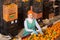 Cheerful woman working on citrus sorting