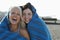 Cheerful Women Wrapped In Blanket