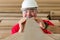 Cheerful worker inspecting quality of wooden plank