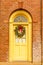 Cheerful Yellow Door with a Wreath