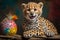 Cheerful Young Cheetah Cub Playing with Colorful Easter Eggs and Paint Stick