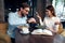 cheerful young couple in cafe breakfast work colleagues lifestyle