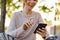 Cheerful young fitness woman relaxing outdoos