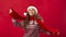 Cheerful young girl wearing cool Christmas outfit on red background