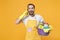 Cheerful young man househusband in apron rubber gloves hold basin with detergent bottles washing cleansers doing