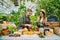 Cheerful young people farmers putting organic food on table at farm sales