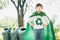 Cheerful young superhero boy with cape and recycle symbol. Gyre