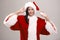 Cheerful young woman dressed as Santa