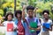 Cheering african male student with group of african american students