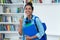 Cheering brazilian female student with backpack