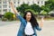 Cheering brazilian girl with curly hair braces