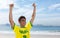 Cheering brazilian sports fan at beach