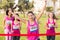 Cheering brunette winning breast cancer marathon