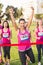 Cheering brunette winning breast cancer marathon