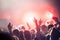 Cheering crowd with hands in air at music festival