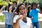 Cheering latin woman with caucasian and african american men