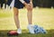 Cheerleader, injury and person with knee pain from sport, training and cheer exercise on a grass field. Health, accident
