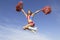 Cheerleader Jumping Midair With Pom Poms