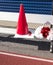 Cheerleaders megaphone, sign and pompoms on a bench