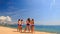 Cheerleaders run out perform Scale Basket Toss on beach