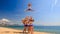 cheerleaders in white blue show Basket Toss on beach