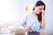 Cheerless tired woman standing in the office