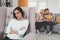 Cheerless young woman sitting in the chair