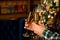 Cheers. Close up photo of two people holding glasses of shampagne on xmas.
