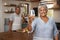 Cheers, wine and portrait of old couple in kitchen cooking healthy food together in home with smile. Toast, drinks and