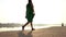 Cheery Young Woman Walks in a Green Dress on The Dnipro Bank in Slo-Mo