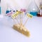 A chees decorated with name plates of additives E, test tubes stand nearby. Food laboratory. Close up on a white table