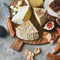 Cheese assortment, figs, honey, fresh bread and nuts, square crop