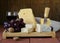 Cheese assortment served on a wooden board