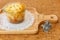 Cheese Baked Penne in glass bowl on wooden plate with miniature soldiers and cowboys riding horses