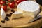 Cheese board - camembert cheese with nuts, cranberries and cherry tomatoes