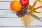 Cheese board with grapes, garnet, orange