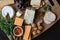 Cheese board serving with figs, caper berries, jam, parsley and pickled onions. Top view photograph with copy space -