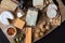 Cheese board serving with figs, caper berries, jam and pickled o