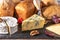 Cheese and bread. many types of bread and cheese. cheese platter, tasting and pairing. An assortment of various types of cheese,