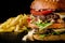 Cheese burger with grilled meat, cheese, tomato and potatoes on dark wooden surface. Ideal for advertisement. Close-up